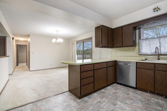 kitchen featuring dark brown cabinetry, dishwasher, light carpet, sink, and kitchen peninsula