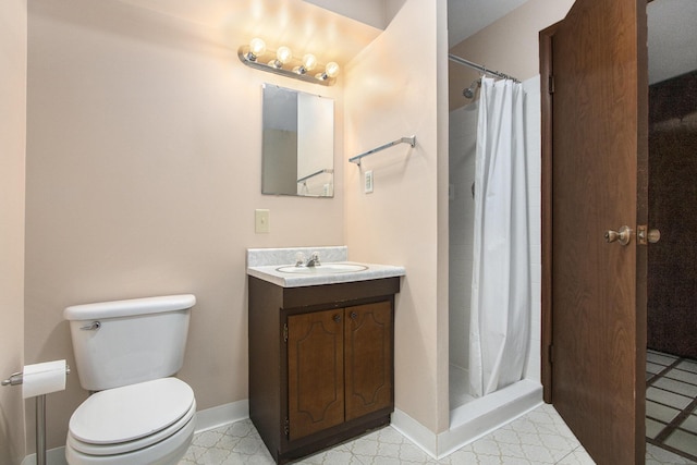 bathroom featuring vanity, toilet, and a shower with shower curtain