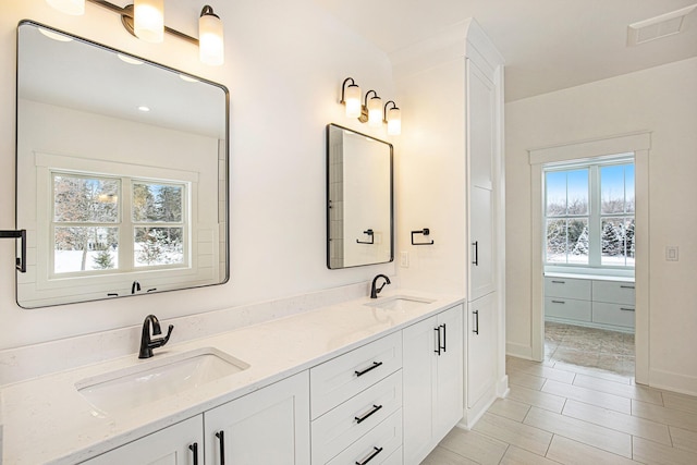 bathroom featuring vanity and tile patterned flooring