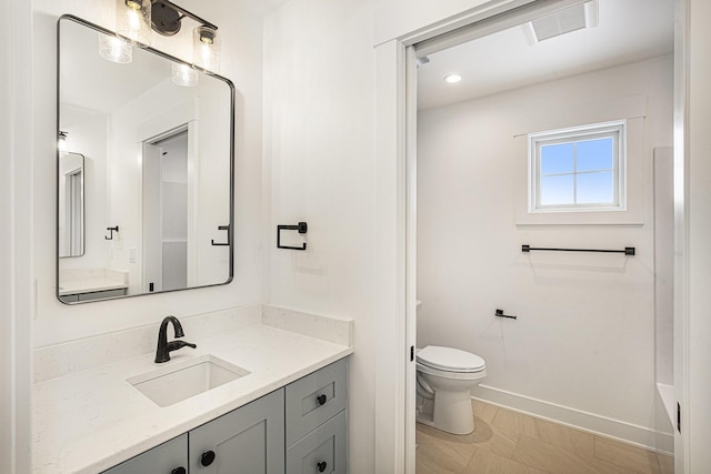 bathroom with vanity and toilet