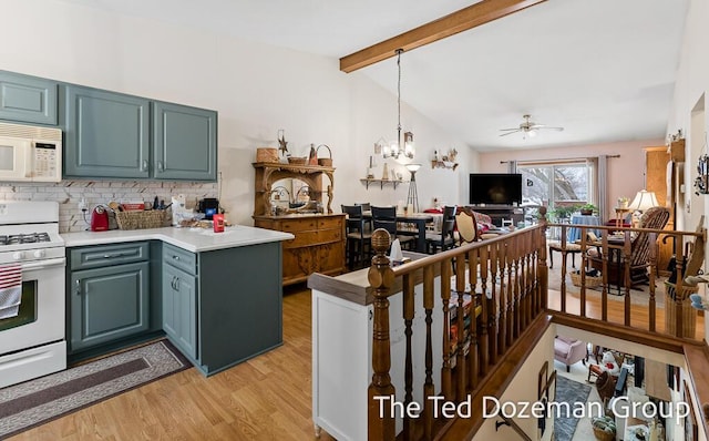 kitchen with pendant lighting, white appliances, tasteful backsplash, lofted ceiling with beams, and light wood-type flooring