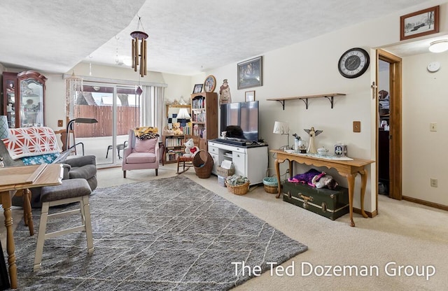 carpeted living room with a textured ceiling