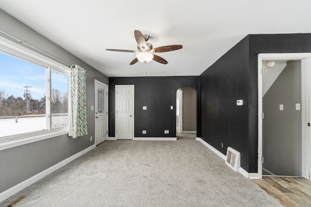 empty room featuring light carpet and ceiling fan