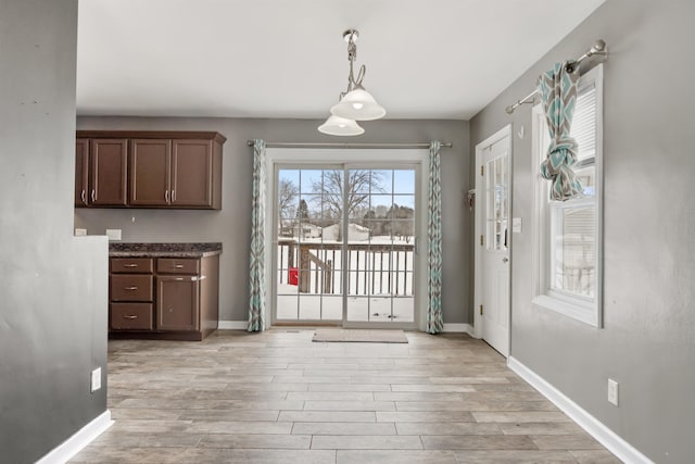 unfurnished dining area with light hardwood / wood-style flooring