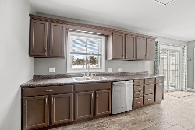 kitchen with dishwasher, sink, and dark brown cabinets