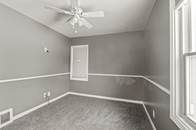 empty room featuring ceiling fan and carpet flooring