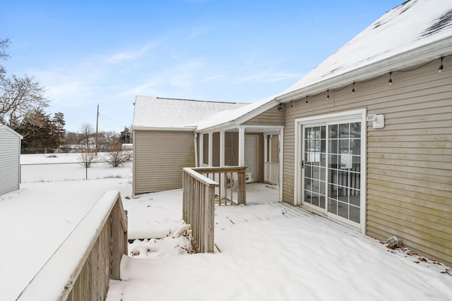 view of snow covered deck