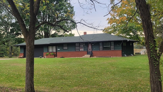 ranch-style house featuring a yard