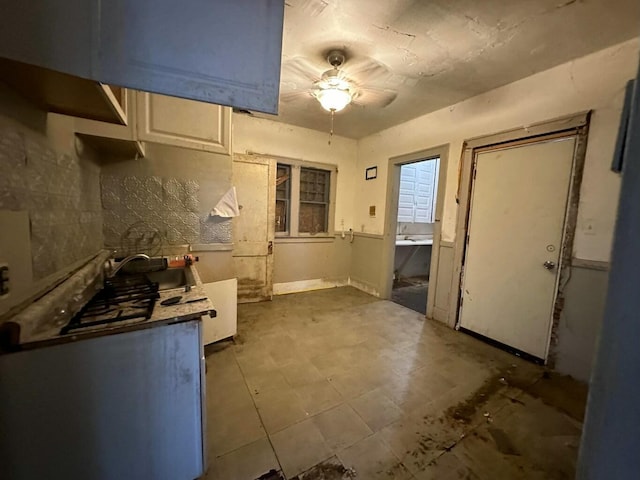 kitchen with ceiling fan and sink