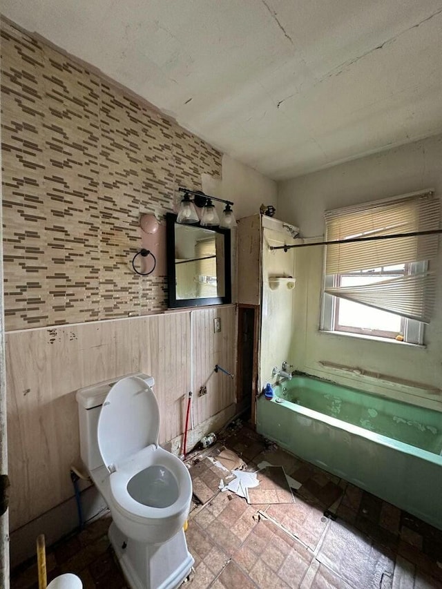 bathroom with shower / tub combination and toilet