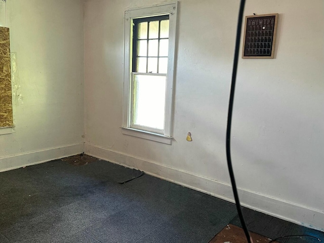 carpeted spare room with plenty of natural light