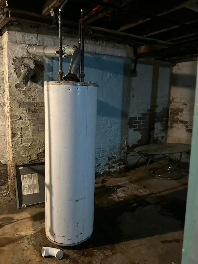 utility room featuring water heater