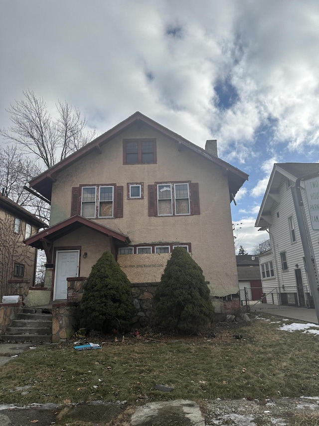 front facade with a front lawn