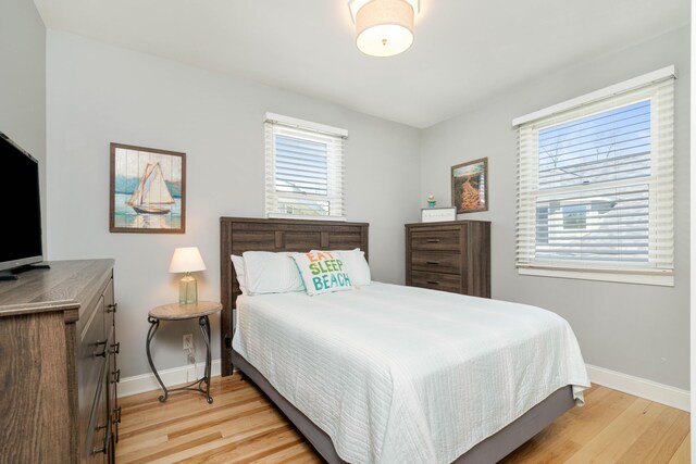 bedroom with light hardwood / wood-style floors