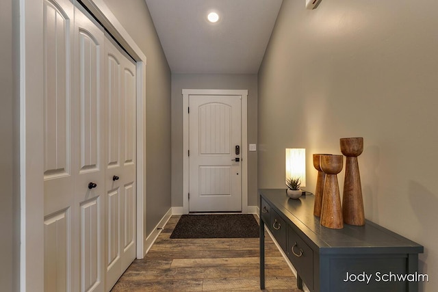 doorway with dark hardwood / wood-style flooring