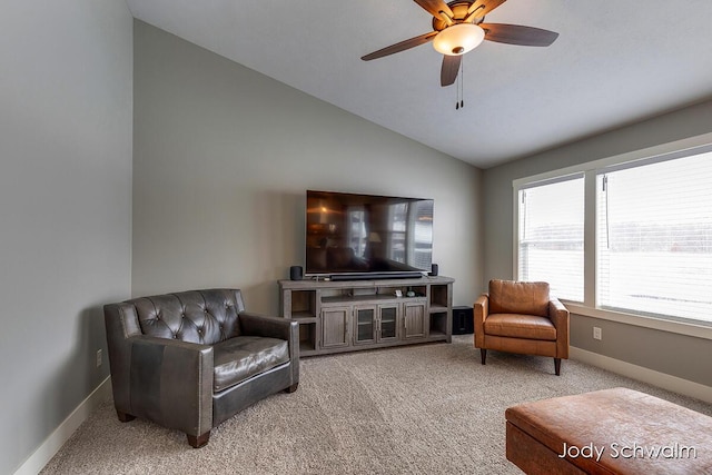 carpeted living room with vaulted ceiling and ceiling fan