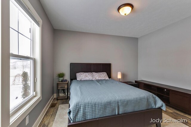 bedroom with wood-type flooring