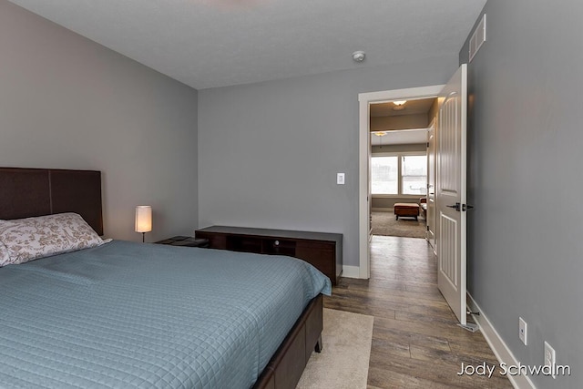 bedroom featuring wood-type flooring