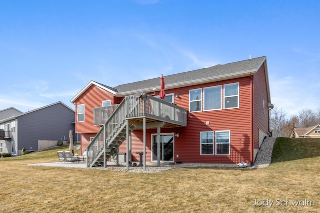 rear view of property featuring stairway, a patio, a lawn, and a deck