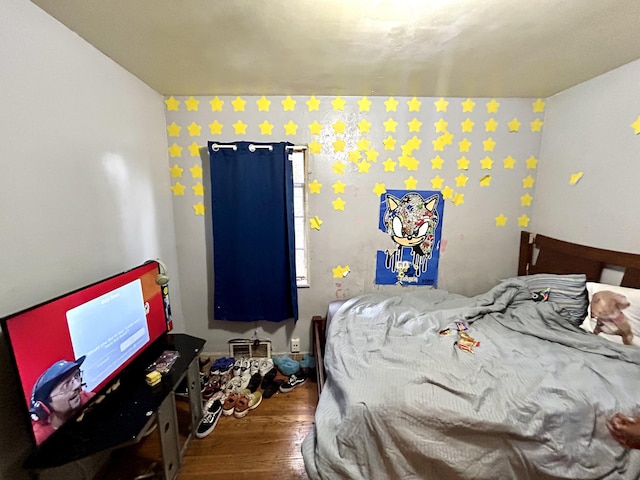 bedroom featuring hardwood / wood-style flooring