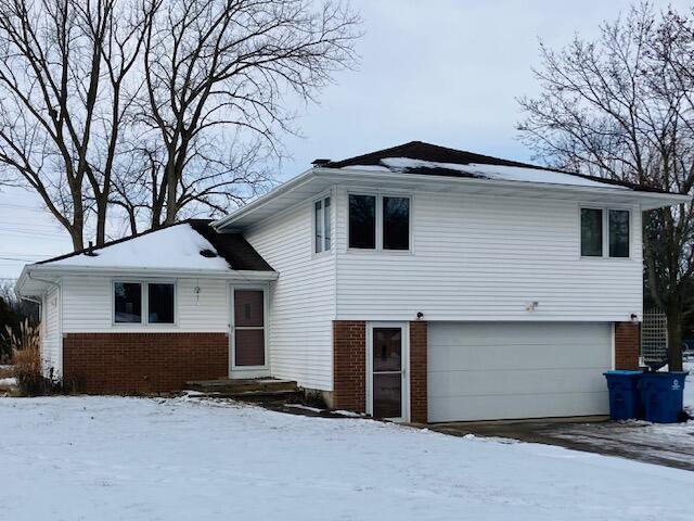 split level home with a garage