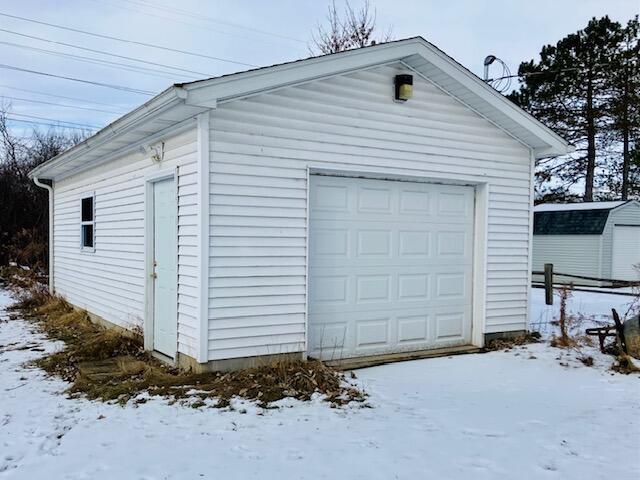 view of snow covered garage