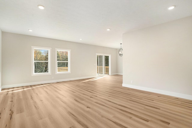 unfurnished room with light hardwood / wood-style flooring