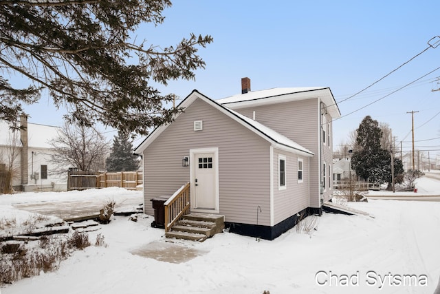 view of snow covered house