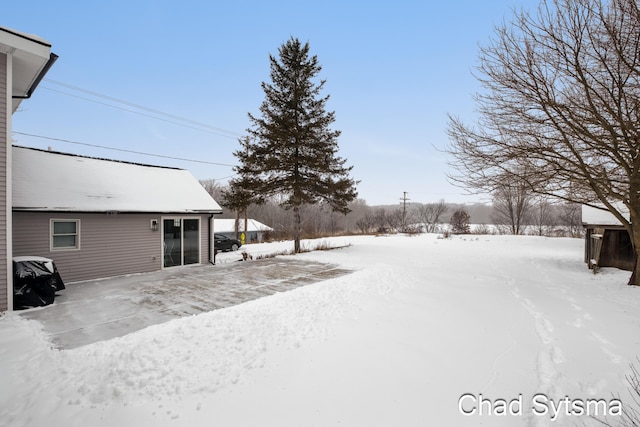 view of yard layered in snow