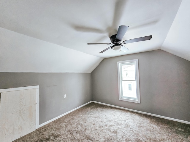 bonus room with lofted ceiling, ceiling fan, and carpet flooring