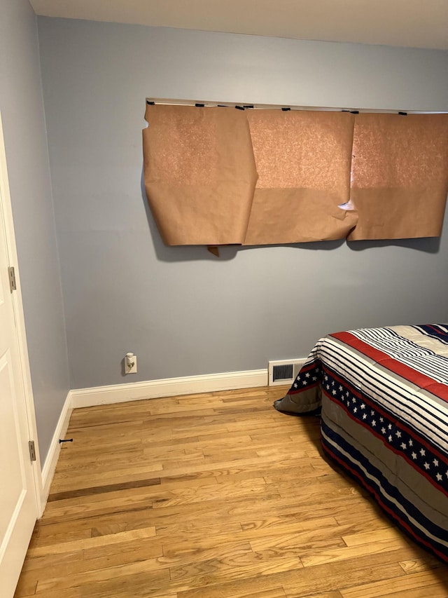 bedroom with light hardwood / wood-style floors