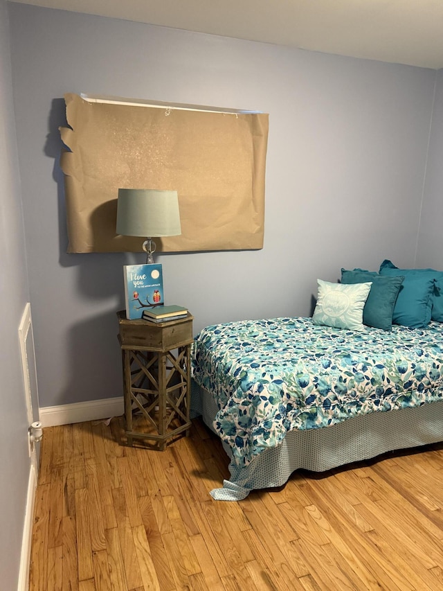 bedroom with wood-type flooring