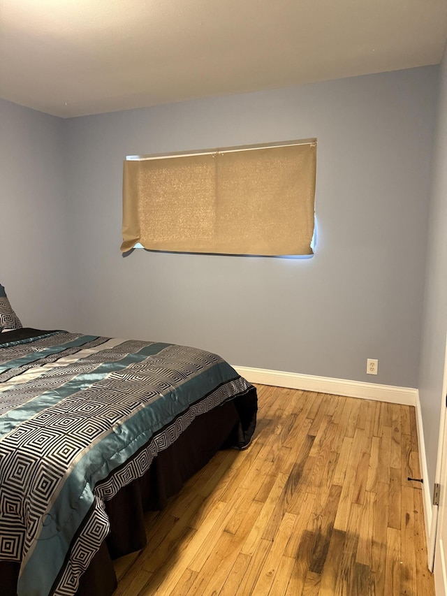 bedroom with light hardwood / wood-style flooring