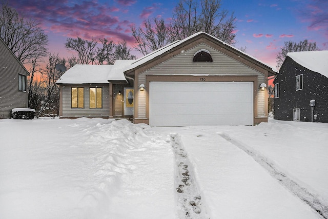 ranch-style house featuring a garage