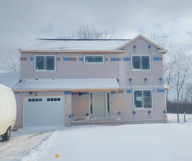 view of front of property with a garage