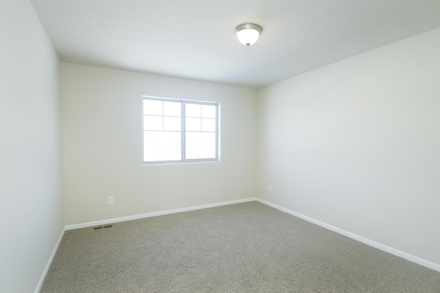 spare room with carpet floors