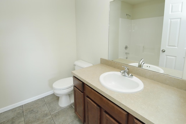 full bathroom with washtub / shower combination, vanity, toilet, and tile patterned flooring