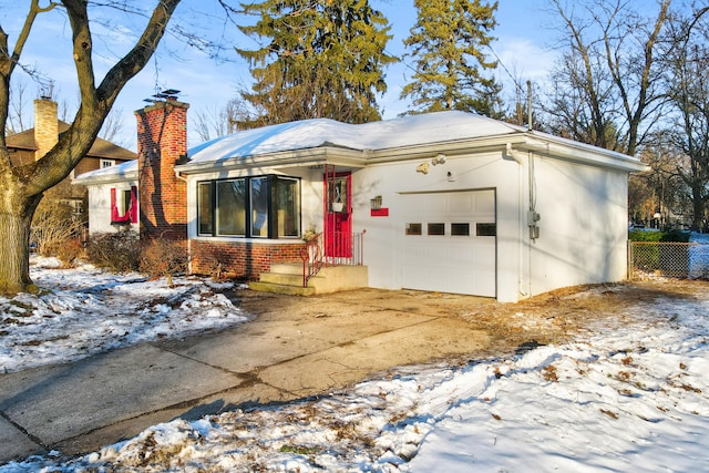 single story home featuring a garage