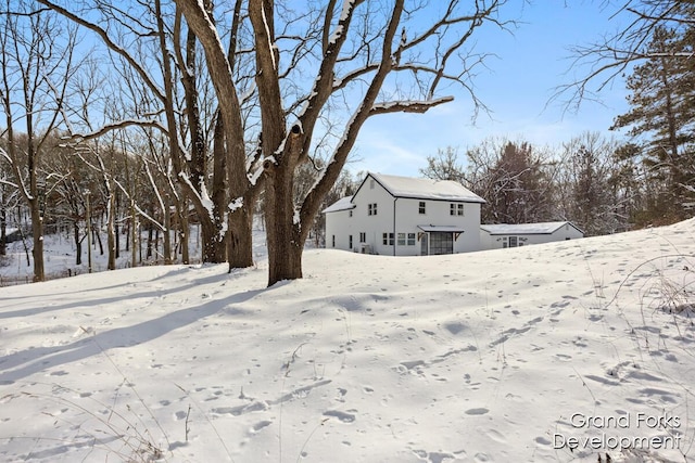 view of yard layered in snow