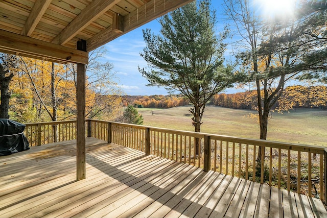 wooden deck featuring a grill