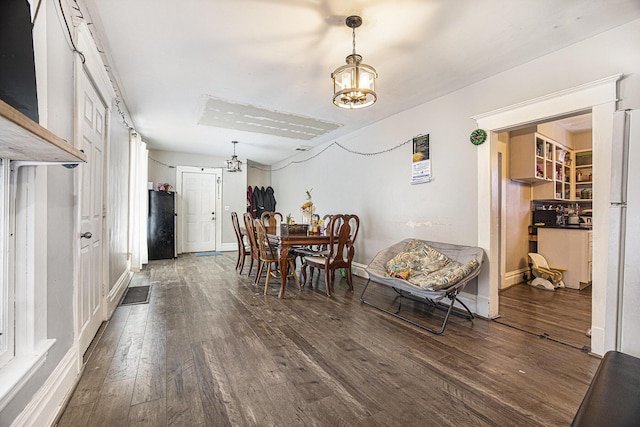 dining room featuring dark wood-type flooring