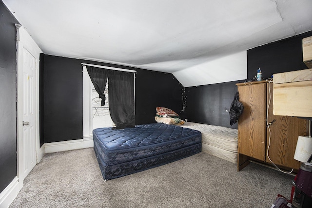 carpeted bedroom featuring vaulted ceiling