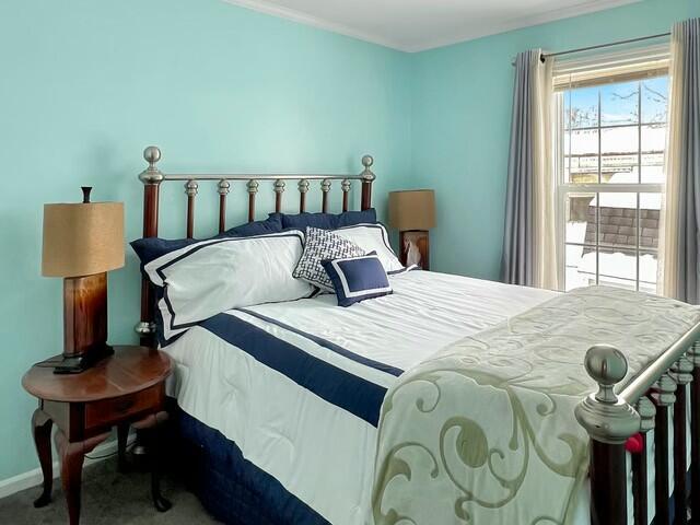 bedroom with ornamental molding