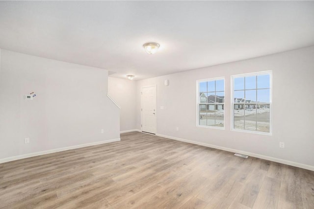 unfurnished room featuring light wood-type flooring