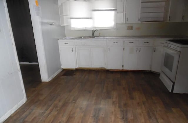 kitchen with white cabinetry, sink, dark hardwood / wood-style floors, and white range with electric stovetop