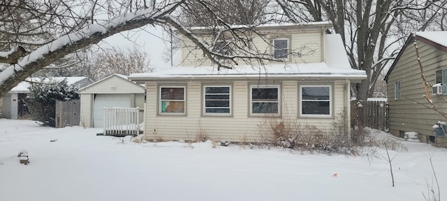 view of front of property with an outdoor structure and a garage