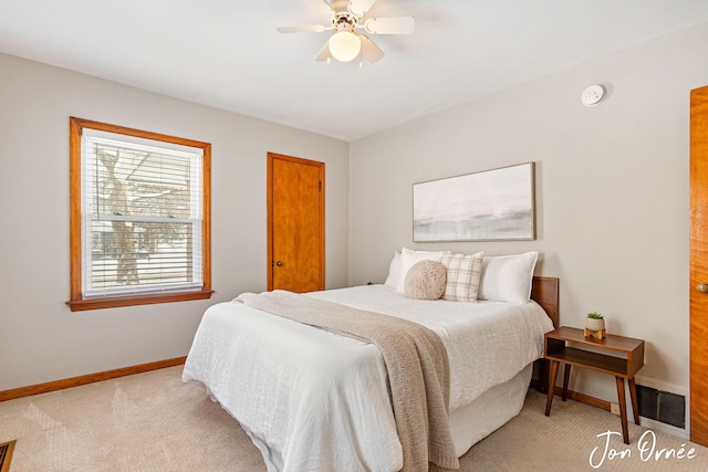 bedroom with light carpet and ceiling fan