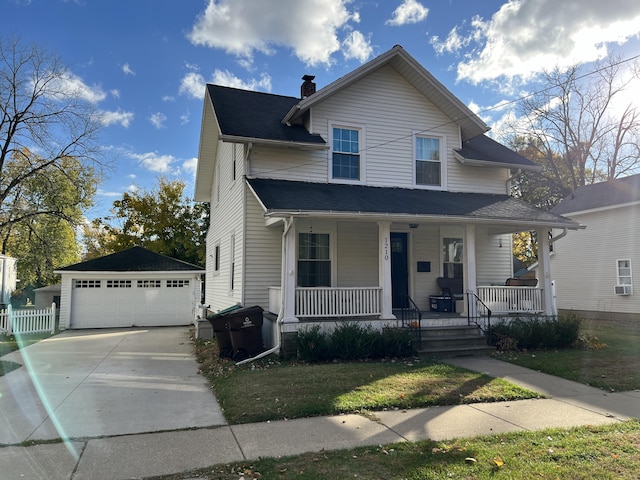 view of front of house featuring a garage, an outdoor structure, and covered porch