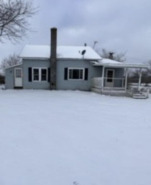 view of snow covered house