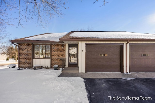 single story home with a garage